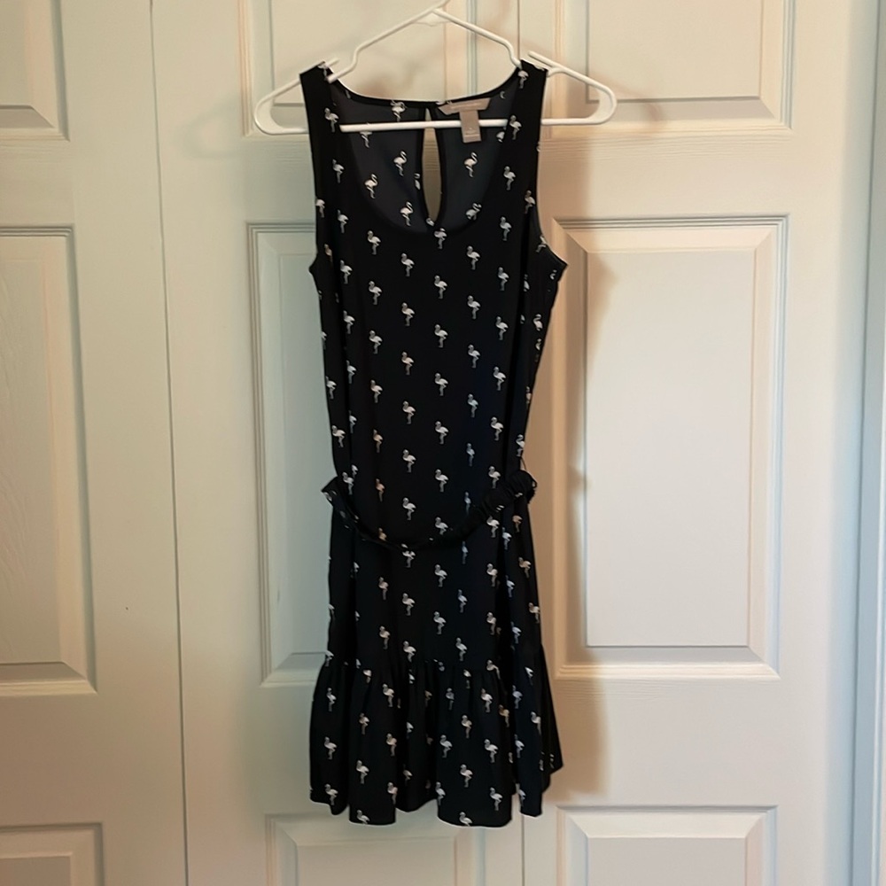 Elegant Black Sleeveless Dress with White Floral Pattern
